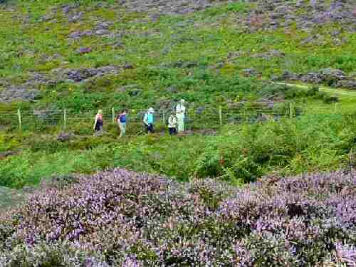 Walkers crossing Stanton Moor